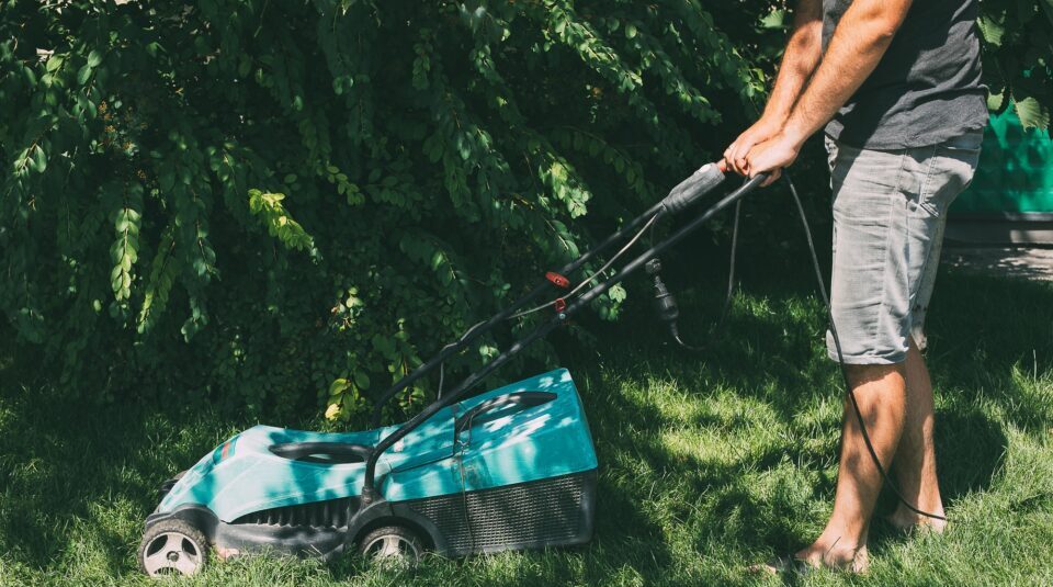 Man is mowing the lawn